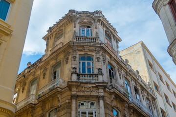 Fototapeta premium Historic buildings on Calle Lamparilla Street at Calle Oficios Street in Old Havana (La Habana Vieja), Cuba. Old Havana is a World Heritage Site. 