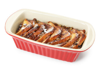Freshly baked bread pudding in baking dish isolated on white