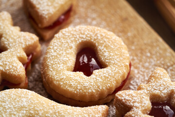 Round Linzer Christmas cookie filled with marmalade and dusted with sugar
