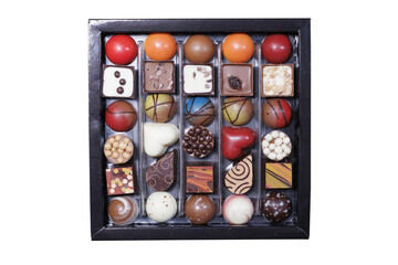 arranged selection of gourmet chocolates with various shapes and colors