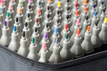 Many colorful markers in bag, closeup. Art supplies © New Africa