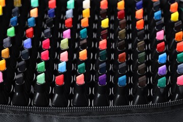 Many colorful markers in bag, closeup. Art supplies © New Africa