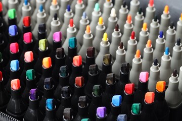 Fototapeta premium Many colorful markers in bag, closeup. Art supplies