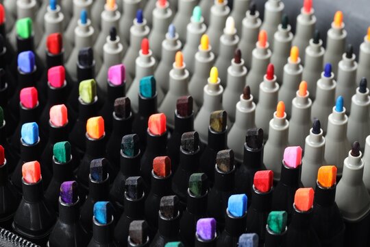 Many colorful markers in bag, closeup. Art supplies