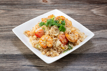 A view of a plate of shrimp fried rice.