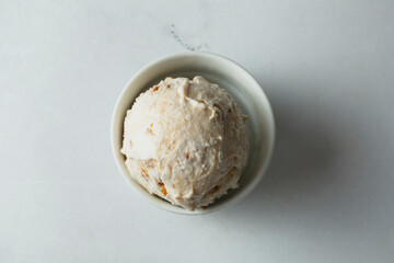 A top down view of a scoop of cookie butter ice cream.