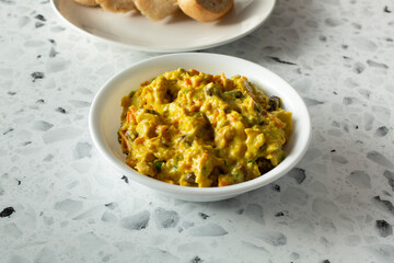 A view of a bowl of curry chicken salad.