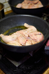 there's a fried chicken in a skillet on the stove