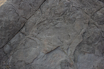 Real stone background with natural sand patterns. Stone background with scratches and patterns