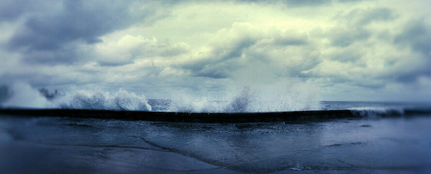 Waves splashing into the Malecon, Havana, Cuba.
