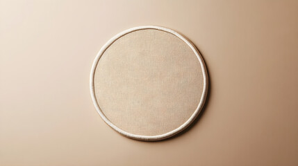 Plain monochromatic circular patch mockup placed on a flat neutral background for versatile embroidery options