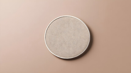 Plain monochromatic circular patch mockup placed on a flat neutral background for versatile embroidery options
