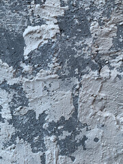 A rough gray concrete surface with imperfections, wear marks, and an industrial aesthetic
