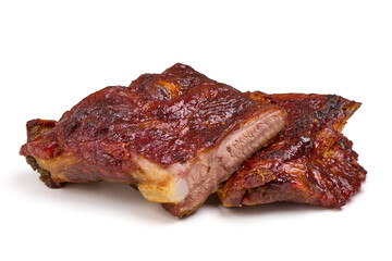 Roasted pork ribs in BBQ sauce with herbs, isolated on white background.