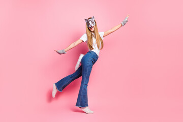 Casual teen dressed in a playful animal-style costume with a pink backdrop