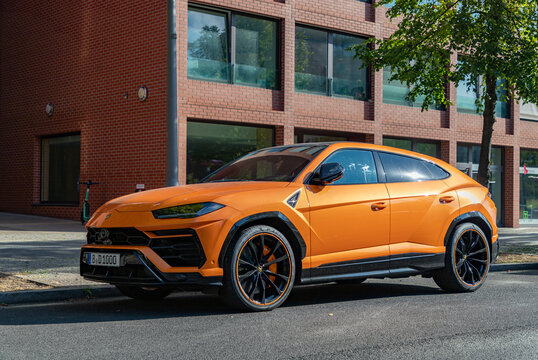 Berlin, Germany - September 25, 2023: A picture of an orange Lamborghini Urus.