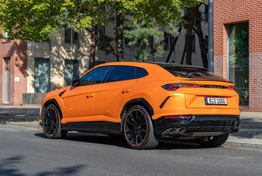 Berlin, Germany - September 25, 2023: A picture of an orange Lamborghini Urus.