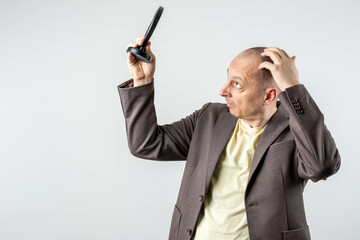 Mature businessman and hair loss issue