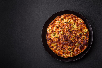 Delicious fresh quiche with broccoli, cheese, spices and herbs