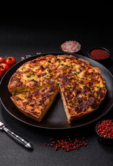 Delicious fresh quiche with broccoli, cheese, spices and herbs