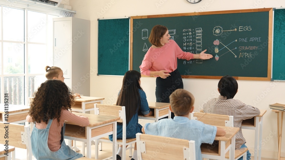 Aufkleber smart teacher checking cute student homework while explaining idea at class. attractive instructor w