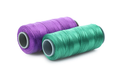 Spools of bright sewing threads isolated on white