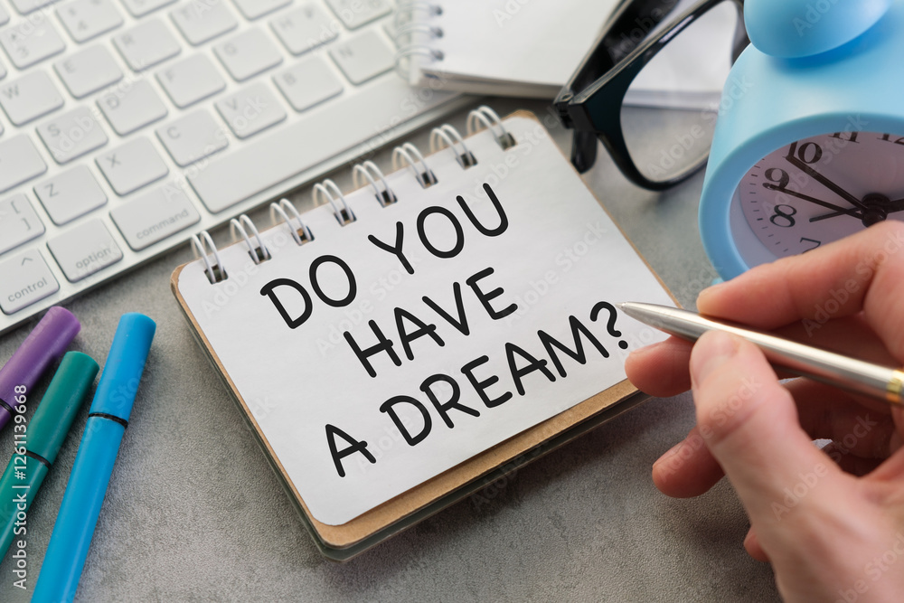 Aufkleber do you have a dream question written on an open notebook with keyboard and office items