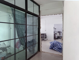 Renovation of office space with glass walls and exposed area