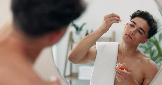 Serum, mirror and skincare with man in bathroom for morning routine, beauty and hydration. Reflection, grooming and cleaning with person at home for self care product, hygiene and cosmetics.