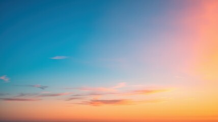 A serene sunset sky showcases vibrant hues of blue and soft peach, creating a tranquil atmosphere perfect for relaxation.