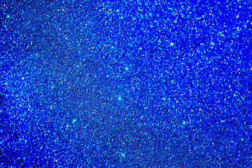 Glittering blue texture with shimmering sparkles on a vibrant background