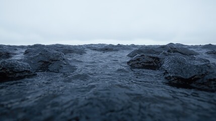 Obraz premium Dark, rocky landscape, overcast sky, water, environmental texture, website background