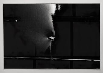 single 6x6 photo contact sheet, glossy paper surface.