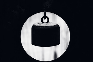 Iron bell - close up - displayed in a circle - black and white