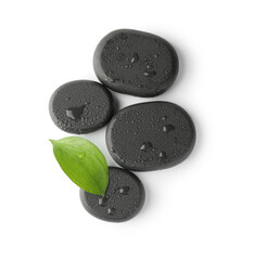 Wet spa stones and green leaf isolated on white, top view