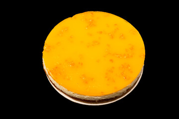 Orange cheesecake isolated on a white background.
