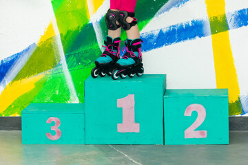 Close up child feet on podium for winners of first, second and third place. Victory and...