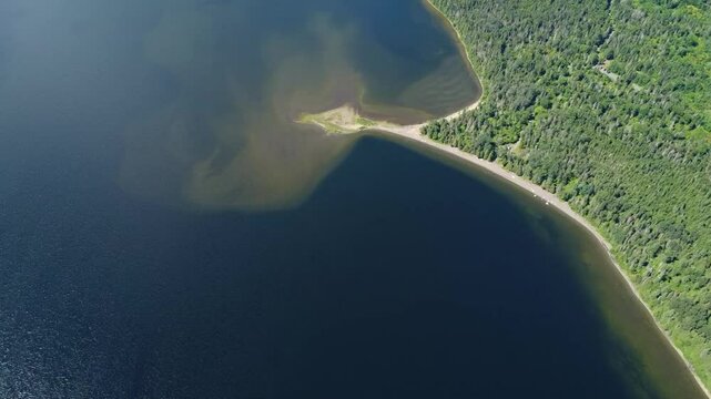 Aerial view of La Pointe-Fine, a popular vacation spot on Lake Matapedia, Qu&eacute;bec. A strip of sand in a freshwater lake bordered by a sandy beach.