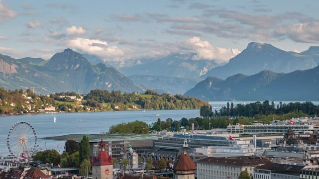 Time lapse panorama clouds moving over of mountains, Lucerne lake and Lucerne old town, Switzerland.