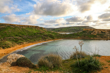 Beautiful, gorgeous, mesmerizing cloudy seascape on the coast of Malta before sunset
