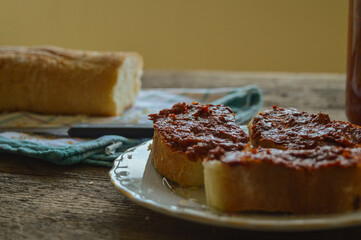 Ajvar spread on bread - vegetable spread from red peppers. Traditional Serbian and Balkan food. 