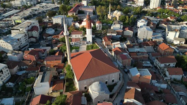 A drone view of the historical buildings such as Sultan Murat Mosque, Clock Tower, Gazi Isa Bey Mosque in Skopje, Macedonia