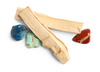 Palo santo sticks and gemstones isolated on white, top view