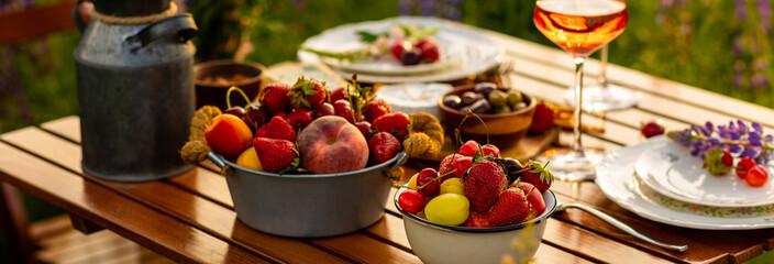 Banner. Elegant gorgeous wedding table decor or romantic dinner arrangement outdoors in blooming...