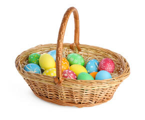 Happy Easter. Bright painted eggs in wicker basket isolated on white