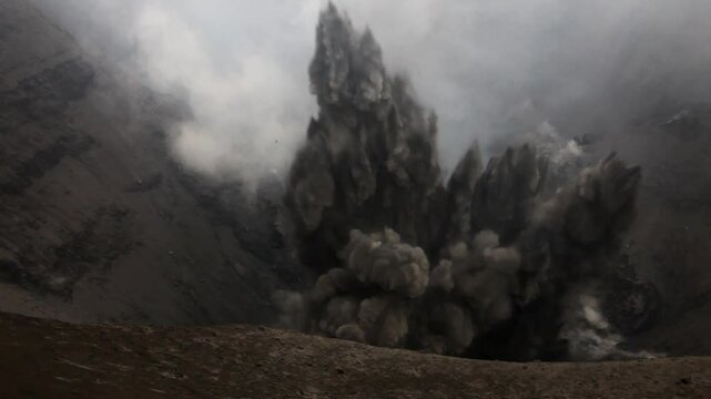 Ash-rich eruptions from rim of active crater on Mount Yasur volcano in Vanuatu.
