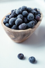 Fresh blueberries in a wood bowl