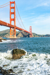 Surf in front of Golden Gate Bridge worldwide known symbol of California