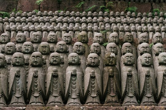 Small praying monk statues at Hase Dera Temple in Kamakura.