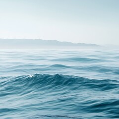 Fototapeta premium Serene ocean horizon with stunning blue reflections and rhythmic golden waves